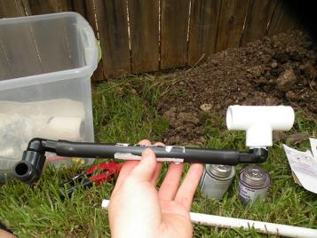 Del Mar sprinkler repair technician assembles pipe array